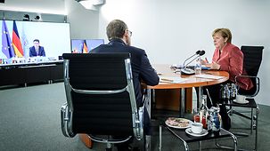 Chancellor Angela Merkel with Michael Müller, Berlin's Governing Mayor, during talks with the state premiers of the federal states
