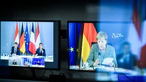 Two monitors in the engineering service room of the situation centre showing the video conference with Angela Merkel, Ursula von der Leyen, Charles Michel, Mark Rutte, Sebastian Kurz and Emmanuel Macron