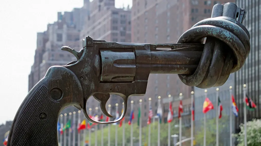 Sculpture of a revolver with its barrel tied in a knot outside the United Nations Headquarters in New York.