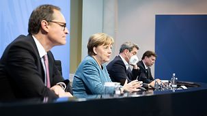 Chancellor Angela Merkel speaks at the press conference following her meeting with the Heads of Government of the Länder to discuss the pandemic.