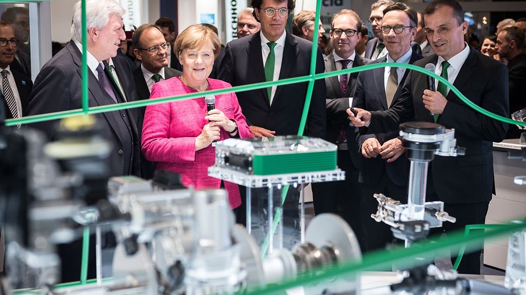 Chancellor Angela Merkel visiting the von Schaeffler booth during her tour following the opening of the 67th International Motor Show