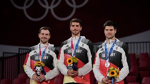 imo Boll, Patrick Franziska und Dimitrij Ovtcharov während der Medaillenvergabe.
