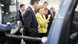 The Chancellor in discussion during her tour of the plant