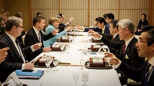 Chancellor Angela Merkel and Shinzo Abe at dinner