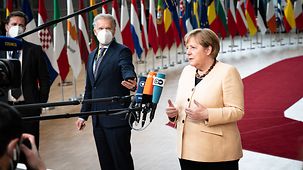 Federal Chancellor Angela Merkel issues a statement on her arrival at the European Council.