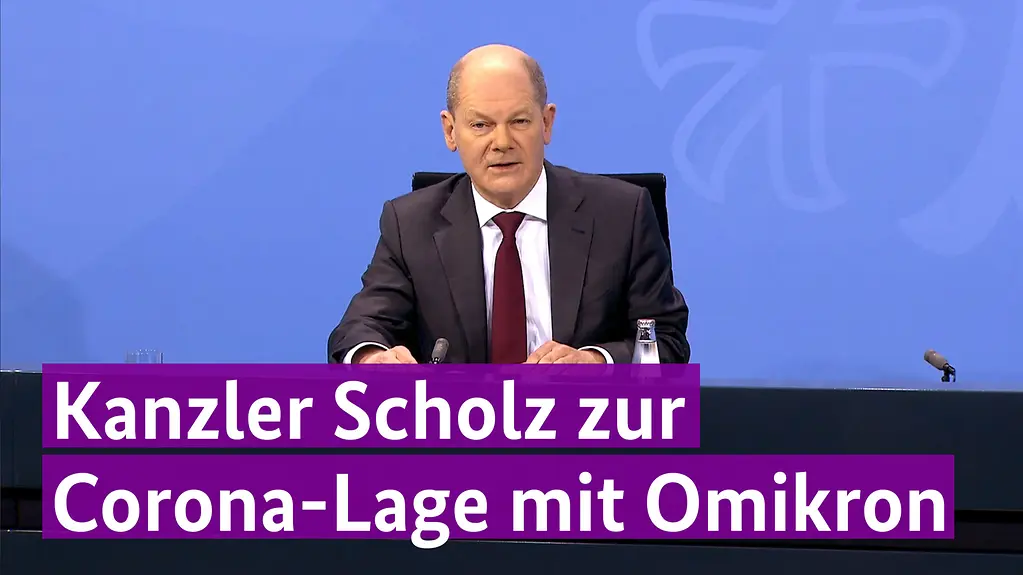 Foto von Kanzler Scholz bei der Pressekonferenz zu der Corona-Lage