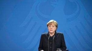 Chancellor Angela Merkel reads a statement on the attack at Berlin's Breitscheidplatz.