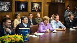 Angela Merkel, David Cameron, José Manuel Barosso and delegation members watch the penalty shootout.