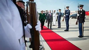US guard of honour salutes the Chancellor.