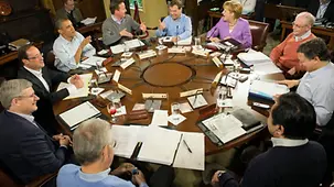 Summit participants hard at work around a table