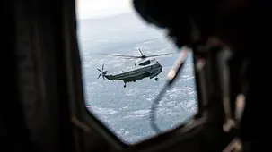 A glimpse of the lead helicopter from the window of the following helicopter