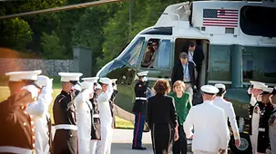 Chancellor Angela Merkel arrives by helicopter.
