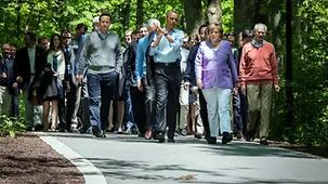 G8 participants on their way to have the family photo taken
