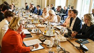 Federal Ministers in discussions during the closed Cabinet meeting at Schloss Meseberg