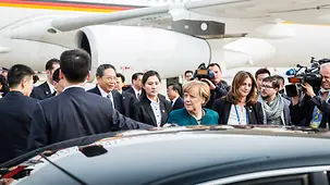 Chancellor Angela Merkel arrives at the airport in Hefei.