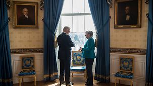 Chancellor Angela Merkel in conversation with President Donald Trump in the Oval Office
