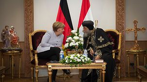 Chancellor Angela Merkel in conversation with Pope Tawadros II, the Pope of the Coptic Orthodox Church of Alexandria