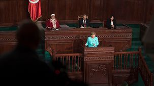 Chancellor Angela Merkel addresses the Tunisian parliament.