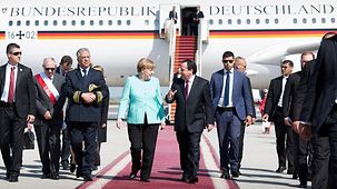 Chancellor Angela Merkel arrives at the airport in Tunis.