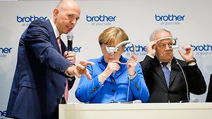 Chancellor Angela Merkel at the Brother stand