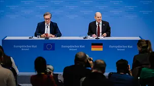 Federal Chancellor Olaf Scholz and Wolfgang Büchner, Deputy Spokesperson of the Federal Government, at a press conference.