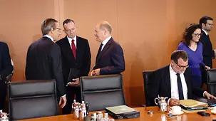 Federal Chancellor Olaf Scholz in conversation before the start of a Cabinet meeting in the Chancellery.