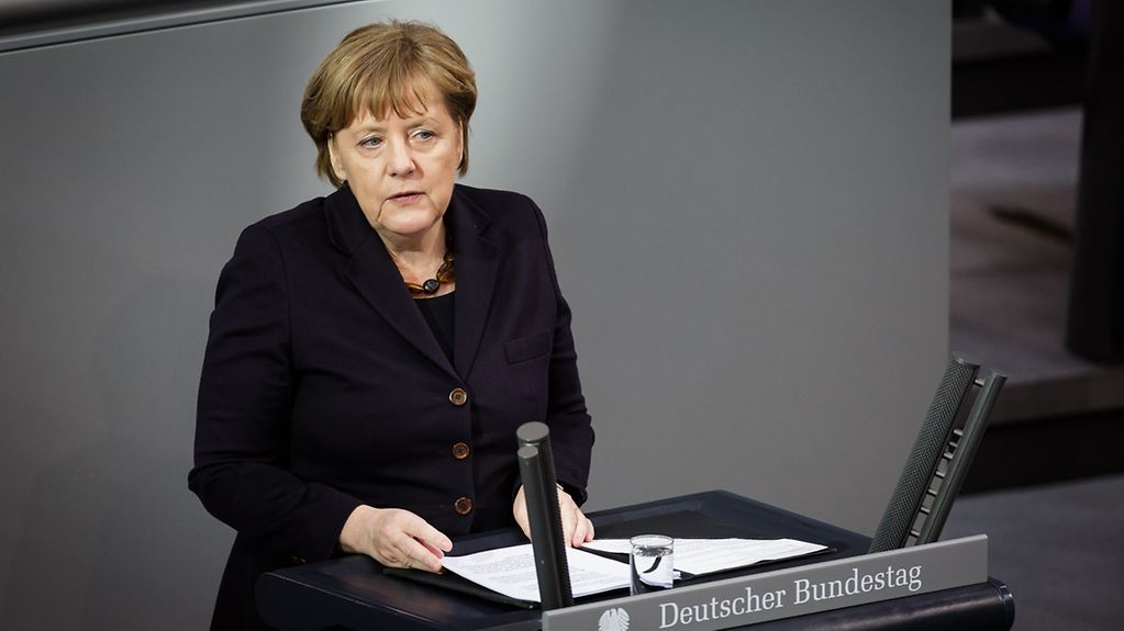 Federal Chancellor Angela Merkel delivers a policy statement to the German Bundestag