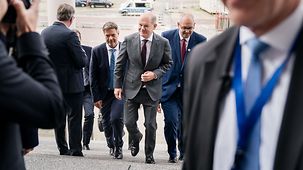 Federal Chancellor Scholz, Minister of Economic Affairs Habeck and Bremen’s Mayor Andreas Bovenschulte arrive at the 13th National Maritime Conference