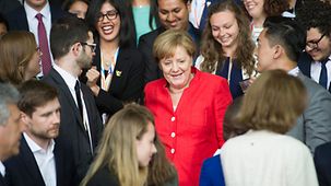 Chancellor Angela Merkel and participants at the Y20 summit gather for a group photo at the Federal Chancellery.
