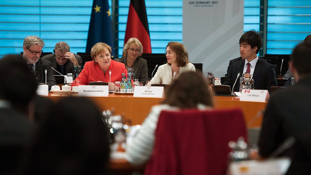 Chancellor Angela Merkel (at left) and Federal Minister for Family Affairs Katarina Barley (SPD) take part in the Y20 (Youth 20) summit 2017 at the Federal Chancellery, with young people from G20 states.