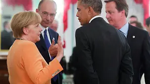 Angela Merkel deep in discussion with Enrico Letta, Barack Obama and David Cameron (left to right)
