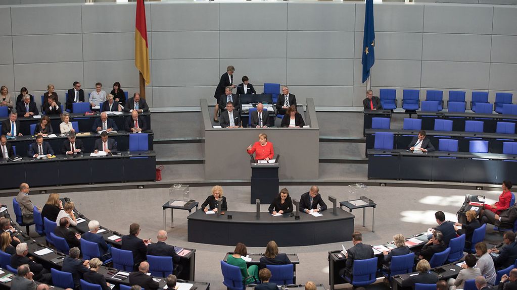 Angela Merkel at the lectern in the German Bundestag