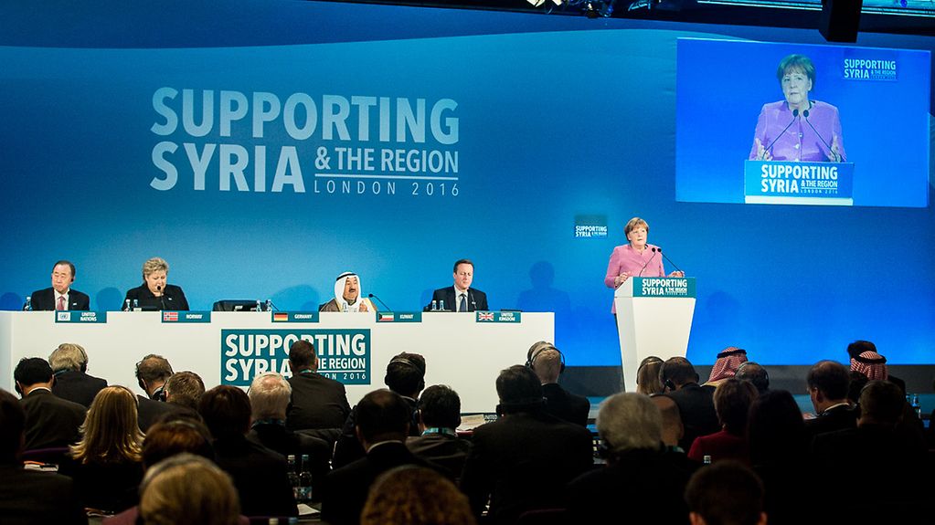 Chancellor Angela Merkel speaks at the start of the Supporting Syria and the Region conference in London.