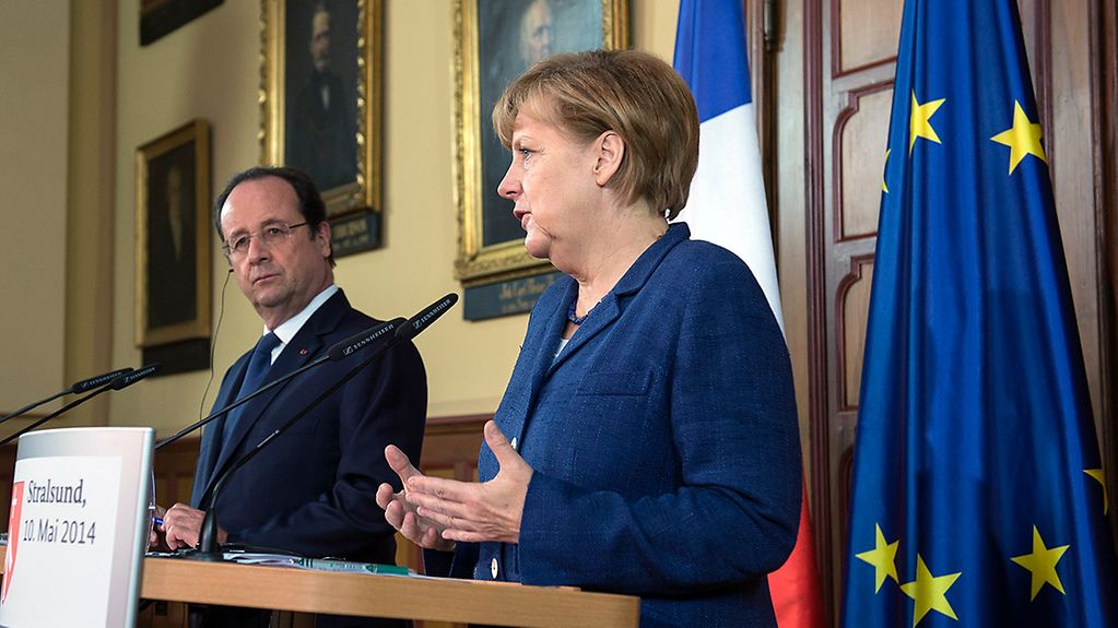 Bundeskanzlerin Angela Merkel und der französische Präsident François Hollande bei einer gemeinsamen Erklärung zur Ukraine.