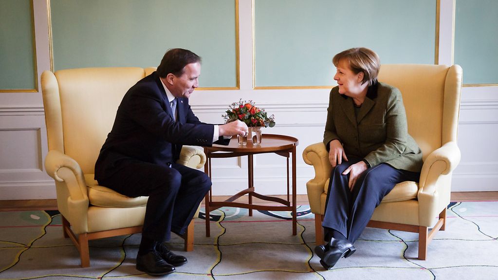 Chancellor Angela Merkel in conversation with Swedish Prime Minister Stefan Löfven