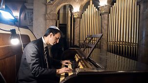 A man plays on the Walcker organ in the "Templo Libertad" synagogue.