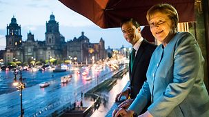 Federal Chancellor Angela Merkel and Enrique Nieto, President of Mexico, standing on a balcony of the Presidential residence.