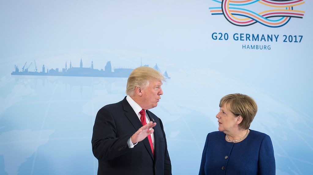 Chancellor Angela Merkel in conversation with Donald Trump, President of the United States of America