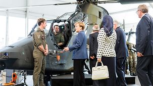 Chancellor Angela Merkel tours the ILA.