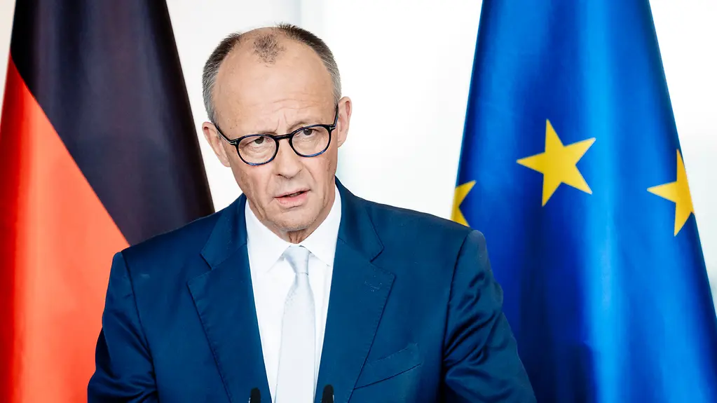 Close-up of Federal Chancellor Friedrich Merz during a press statement.