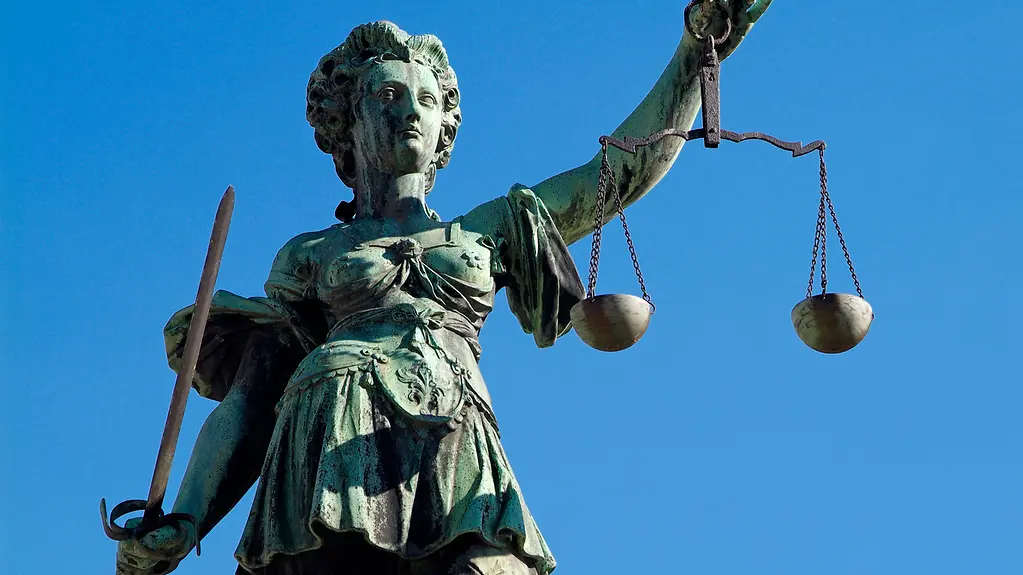 Justitia against a blue sky