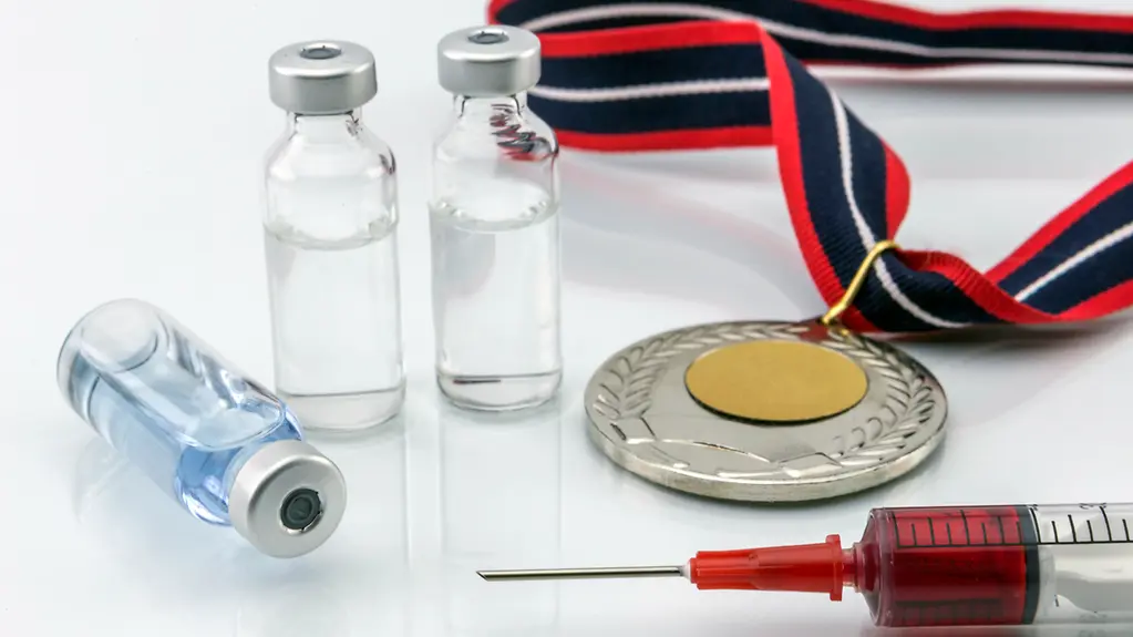 Medaille und Dopingspritze