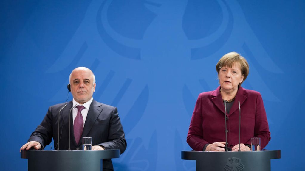 Angela Merkel and Iraq's Prime Minister at a joint press conference