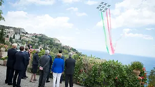 During an air display, Italy's flag appears in the sky.
