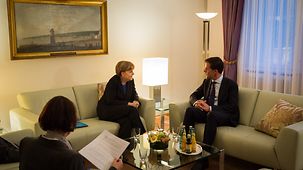 Chancellor Angela Merkel in conversation with Dutch Prime Minister Mark Rutte.
