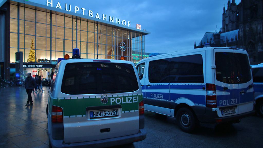 Police vans in front of Cologne's main railway station on 5 January 2016