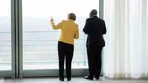 Chancellor Angela Merkel speaks with Ghana's President, John Dramani Mahama, at the Federal Chancellery.