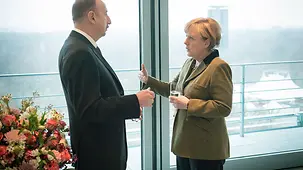 Chancellor Angela Merkel talks with Azerbaijan's President Ilham Aliyev.