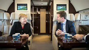 Chancellor Angela Merkel and Dutch Prime Minister Mark Rutte in the aircraft