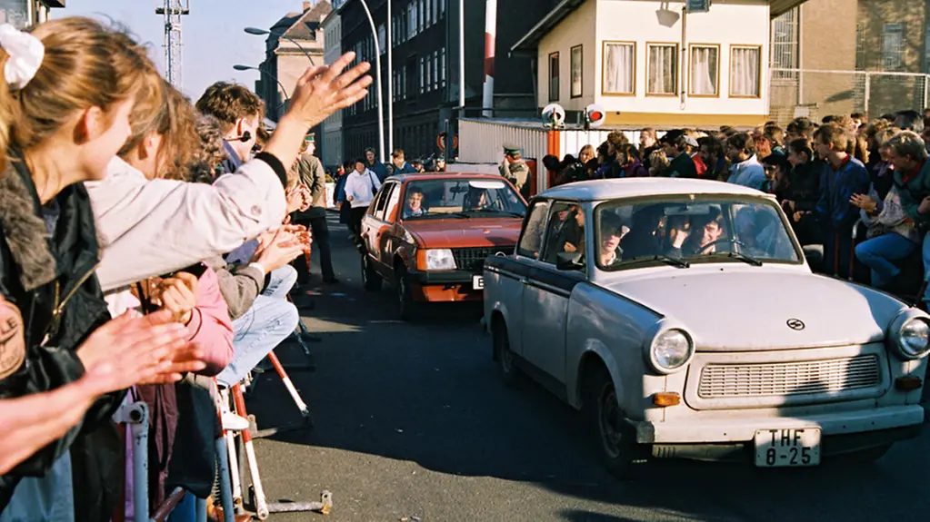 East Germans drive across the border into West Berlin.